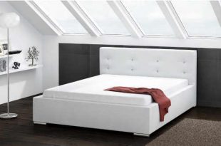 Čalouněná postel o rozměru 160x200 cm v bílém provedení